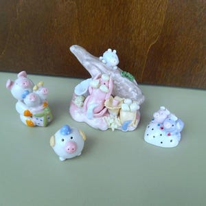whimsical miniature porcelain pig family 4 figurines / handmade / pastel colored / vintage