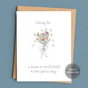May include: A white greeting card featuring a hand-drawn bouquet of colorful flowers tied with a bow. The text reads Wishing You a shower of BLESSINGS on this special day! The card is placed against a brown envelope. A circular digital download badge is visible.