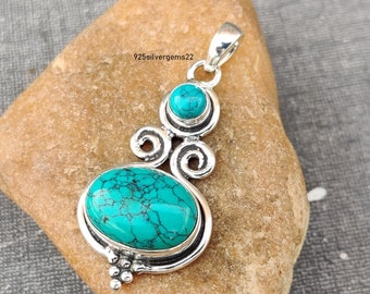 May include: Sterling silver pendant featuring a turquoise gemstone with a swirling design. The pendant has a bail for attaching to a chain.