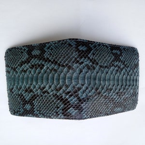 May include: A blue snakeskin wallet with a textured pattern.