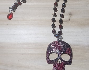 Blood red skull on 20" red/black crystal necklace, with red crystal drop at back
