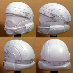 May include: Four white plastic helmets with a futuristic design. The helmets have a visor and a chin guard. The helmets are shown from different angles.