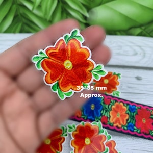 May include: A set of five orange and green embroidered flower iron-on patches. The patches are approximately 1.4 inches in diameter.  35*35 mm Approx.