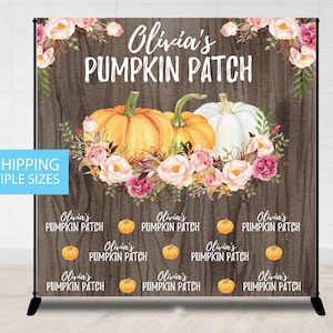May include: A rustic wooden backdrop with a floral design and the text "Olivia's Pumpkin Patch". Two pumpkins, one orange and one white, are featured in the center. Smaller pumpkins are scattered around the bottom of the backdrop with the text "Olivia's Pumpkin Patch" repeated.