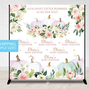 May include: A white backdrop with a watercolor design of pumpkins, flowers, and greenery. The text "Our Sweet Little Pumpkin is on her way!" is at the top of the backdrop. The text "Olivia's Baby Shower" is repeated five times in pink lettering.