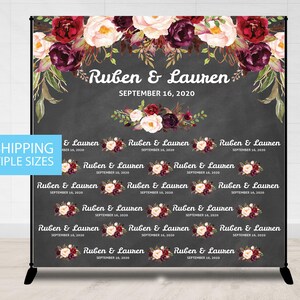 May include: A black backdrop with a floral design in shades of burgundy, pink, and white. The text "Ruben & Lauren" is written in white with the date "September 16, 2020" below it. The backdrop is designed for a wedding or engagement party.