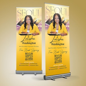 May include: Two yellow and gold retractable banners. Each banner features a photo of Latisha Washington, the author, and the word "SEOUL" at the top. The banners also include the text "Meet The Author, Experience The Story. Free Book Signing."