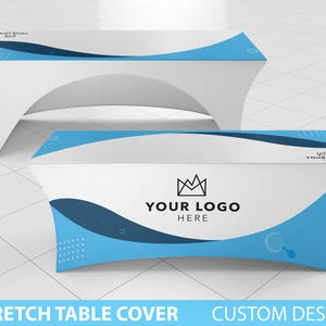 May include: A white stretch table cover with a blue and black abstract design. The design features a crown and the text "YOUR LOGO HERE".