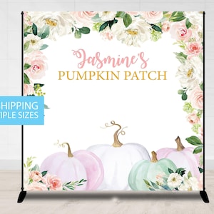 May include: A white backdrop with a floral border and the text "Jasmine's Pumpkin Patch". Three pastel pumpkins are in the bottom center of the backdrop.