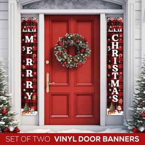 May include: Set of two vinyl door banners with a red and black plaid background. One banner says "Merry" and the other says "Christmas".