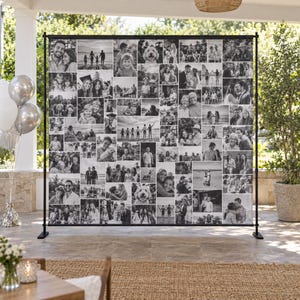 May include: A large rectangular photo collage backdrop mounted on a black metal stand, featuring numerous black and white photographs of people, families, and pets arranged in a grid pattern, displayed outdoors on a stone patio.