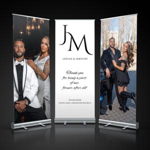 May include: Three retractable banner stands with wedding photos and text. The center banner reads "JM" and "Joshua & Jennifer" with the text "Thank you for being a part of our forever after all" and the date and location.