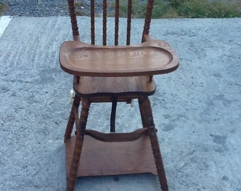 antique wooden high chair with metal tray