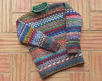 9 years. Colorful children's sweater, hand-knitted