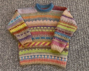 4 years. Colorful children's sweater, hand-knitted gradient colormix with patterns