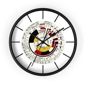 May include: A black and white clock with a circular design. The clock face features a red, yellow, and black circular design with the text "TIME OF ENTRY" and "HOURS AFTER ENTRY".
