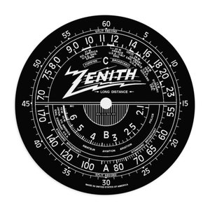 May include: A black and white Zenith radio dial with a long distance setting and a split second setting. The dial has numbers from 1 to 60 and markings for different radio bands, including standard broadcast, amateur, aviation, and police.