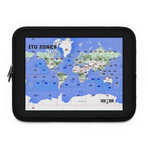 May include: A black laptop sleeve featuring a world map depicting ITU zones. The map is blue and white with red lines. The text "ITU ZONES" is in blue at the top of the map.