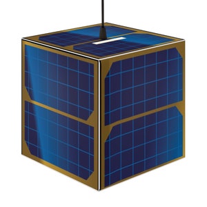 May include: A small, cube-shaped satellite with solar panels on all sides. The satellite has a gold-colored frame and a black antenna extending from the top.