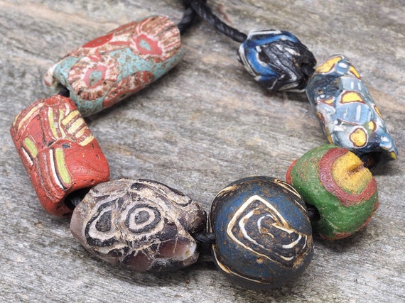 7 Ancient Medieval Islamic Glass Beads. 900-1200 CE. Western Asia