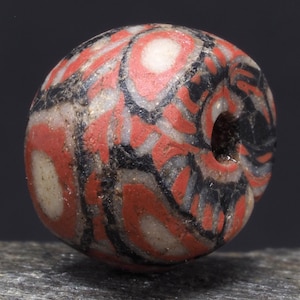 Ancient Medieval Islamic glass bead. ø 11 mm. 900-1200 CE. Western Asia. Tribal, ethnic jewelry