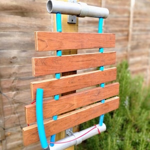 Jojoba-phone. Hardwood marimba.pentatonic. 5 or 6 notes. Playground instrument.