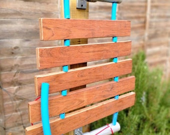 Jojoba-phone. Hardwood marimba.pentatonic. 5 or 6 notes. Playground instrument.