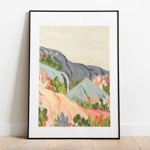 May include: A framed abstract painting of a landscape with blue, green, and pink mountains and flowers. The painting is in a black frame.