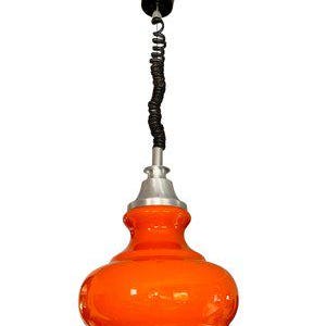 May include: Orange glass pendant light with a black cord and a silver metal base.