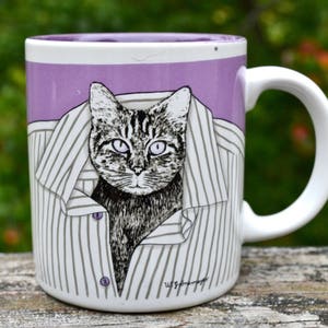 Cat Mug. Cat Lover Mug. Cat in Laundry. Tiger Cat Poking Head Out of Folded Striped Shirt. Bad Cat.  Bad Kitty.  - VCMS245
