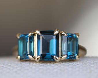 3 Stone Natural Emerald Cut London Blue Topaz Ring in 14K Gold