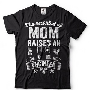 May include: Black t-shirt with a white graphic that says "The best kind of mom raises an engineer". The graphic includes various engineering-related icons, such as a satellite dish, a circuit board, a multimeter, and gears.
