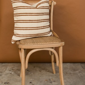 The Rome pillow cover in rust. A cotton woven pillow cover.