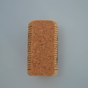 Cork card holder from different vineyards. Used for rustic wedding cards, wedding booths, anniversaries, parties and table decorations. on a wooden base with decorative flowers. for wedding favors