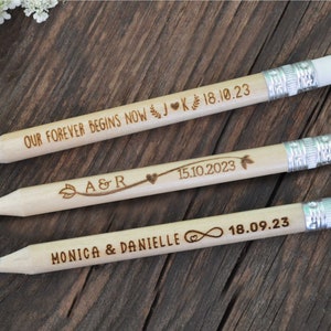 3 personalized mini golf pencils, used for wedding favors and decorations at country style wedding, with white eraser, on wooden table with decorative flowers. An excellent gift for guests and all your loved ones.