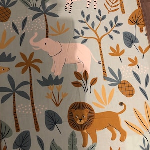 May include: A blue fabric with a repeating pattern of a zebra, elephant, lion, and tropical plants. The animals are in a cartoon style and the plants are in a stylized design.