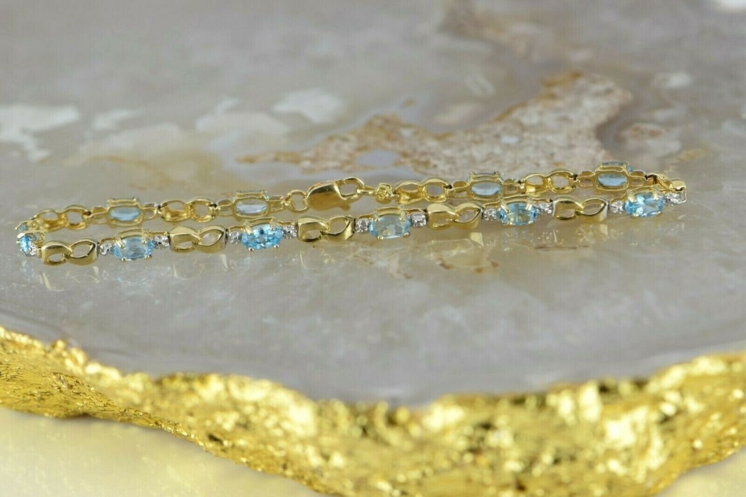 10K YG 3ct Tw Blue Topaz and Diamond Illusion Bracelet 7