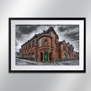 May include: A brick building with a green door and the text "Salford Lane Club" above it. The building has a dark gray roof and is set against a cloudy sky.