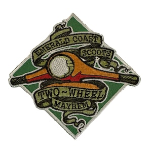May include: A green diamond-shaped patch with a yellow and red motorcycle and the text "Emerald Coast Scouts Two-Wheel Mayhem" in a white banner.
