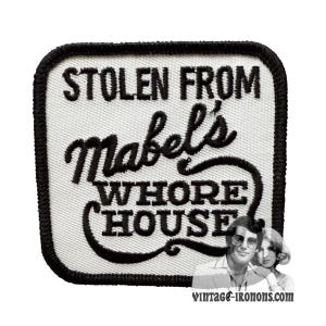 May include: White embroidered patch with black text that reads "Stolen from Mabel's Whore House".
