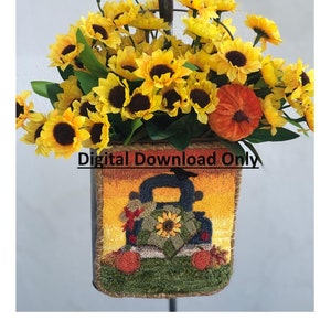 Puede incluir: Una cesta decorativa con temática otoñal llena de girasoles amarillos brillantes y una pequeña calabaza naranja. La cesta presenta un diseño colorido de un camión que transporta girasoles, con el texto "Digital Download Only".
