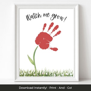 May include: Printable art featuring a red handprint flower with a green stem and white flowers in the grass. The text "Watch me grow!" is at the top of the image.