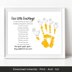 May include: White framed print with the poem "Five Little Ducklings", illustrated with duck drawings and a yellow handprint. The text includes the poem's lyrics. The frame is white.