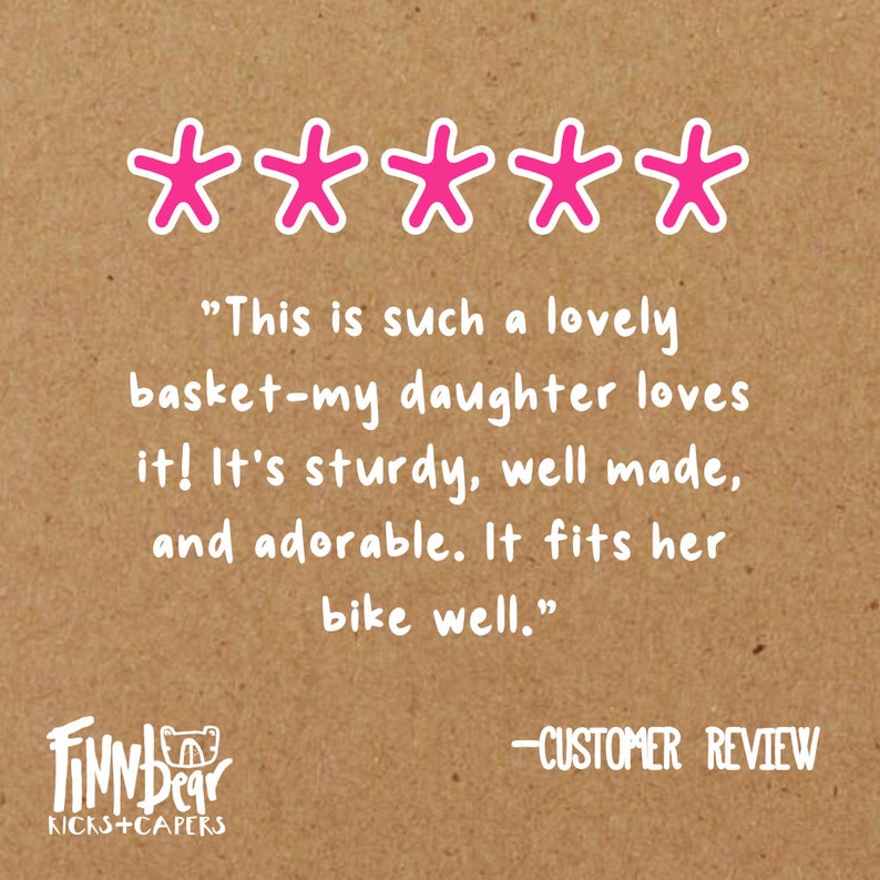 May include: A customer review on a brown background with five pink star icons. The text reads: "This is such a lovely basket-my daughter loves it! It's sturdy, well made, and adorable. It fits her bike well."