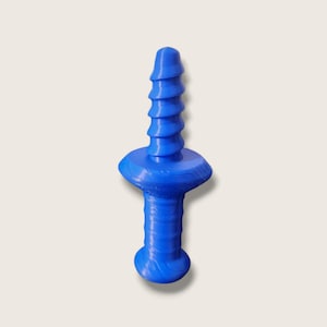 May include: A blue sex toy with a phallic design and a textured finish. It has a rounded base, a cylindrical shaft, a flared midsection, and a ridged top. The object is made of a solid, opaque material.