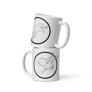 Dinosaur Coffee mug depicting a Triceratops and a T-Rex