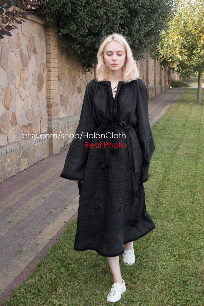 May include: A black embroidered dress with long sleeves and a tie at the neckline. The dress has a geometric pattern and is worn with white sneakers. The text "etsy.com/shop/HelenCloth Real Photo" is visible on the image.
