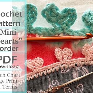 May include: Crochet pattern for a "Mini Hearts" border. The pattern includes a stitch chart, large print, and is written in U.S. terms. The image shows a close-up of the crochet border with a crochet hook.