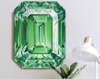 Può includere: Un dipinto di uno smeraldo verde con un design geometrico. Il dipinto è incorniciato e appeso a una parete bianca.