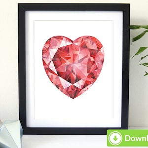 May include: A framed print featuring a heart-shaped gemstone illustration. The artwork showcases a faceted, red gemstone design with varying shades of red and pink. The print is set against a white background and framed in a black frame.